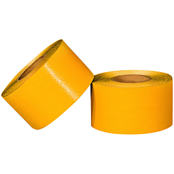 Two rolls of Cortina yellow pavement marking tape.
