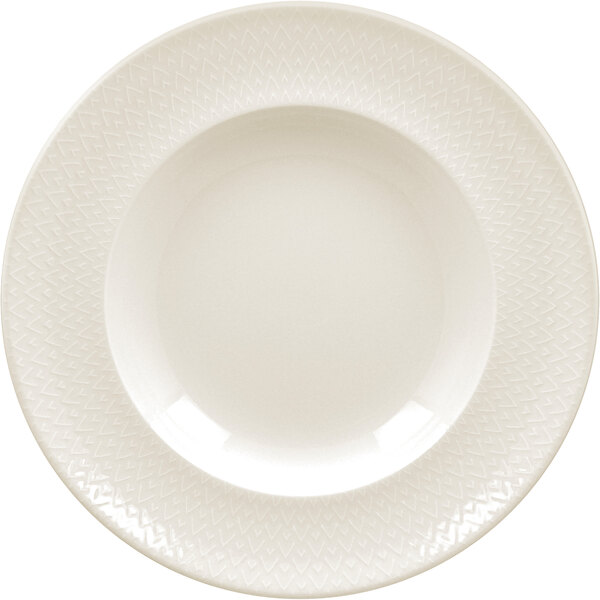 A close-up of a RAK Porcelain ivory deep plate with a zigzag pattern.