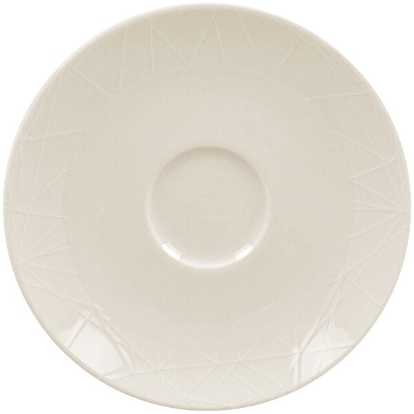 A RAK Porcelain Wonder ivory porcelain saucer with a circular edge.