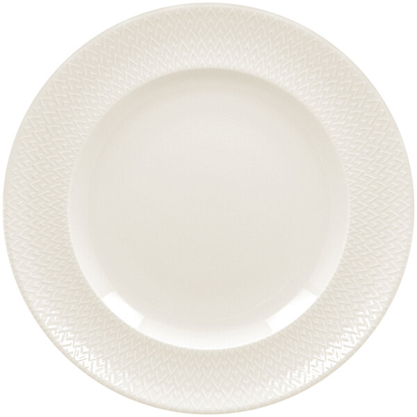 A close-up of a RAK Porcelain ivory flat plate with a zigzag pattern.