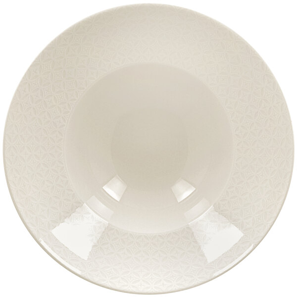 A RAK Porcelain ivory porcelain plate with an embossed pattern on it.