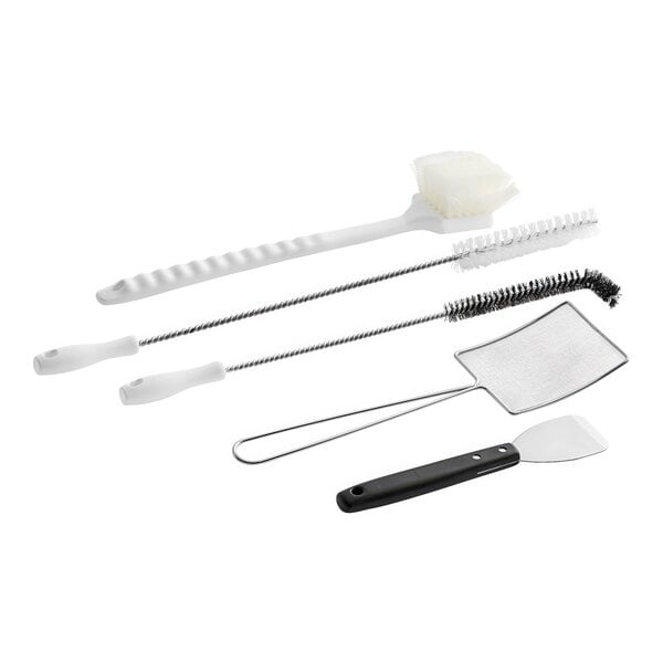 A white Henny Penny fryer cleaning kit with brushes and a sponge.