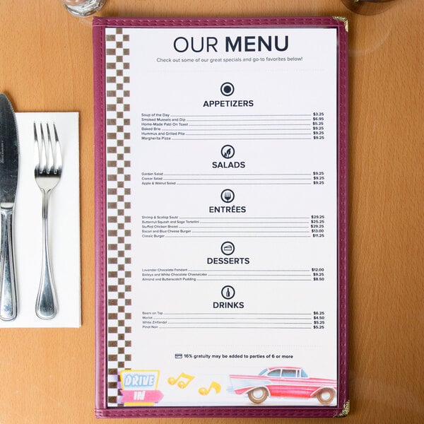 Menu paper with a retro jukebox design on a table with a menu and a fork and knife.
