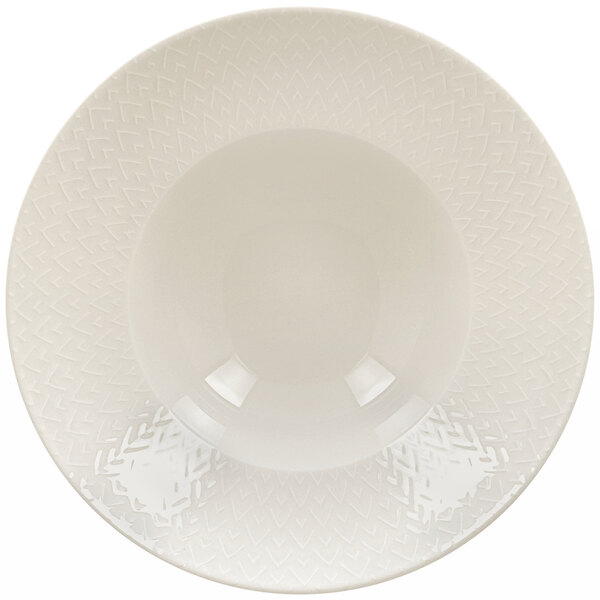 A RAK Porcelain ivory porcelain plate with an embossed pattern.