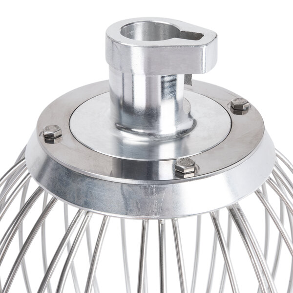 A metal wire whisk with a metal handle.