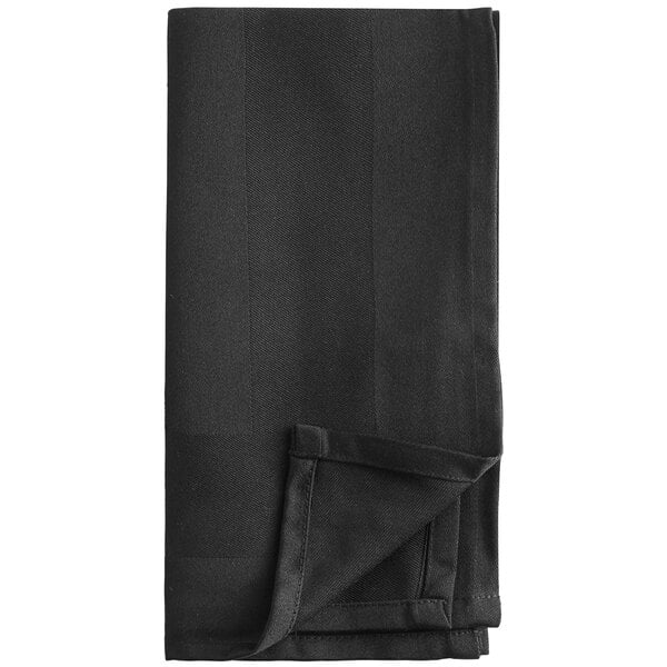 A folded black cloth napkin on a white background.