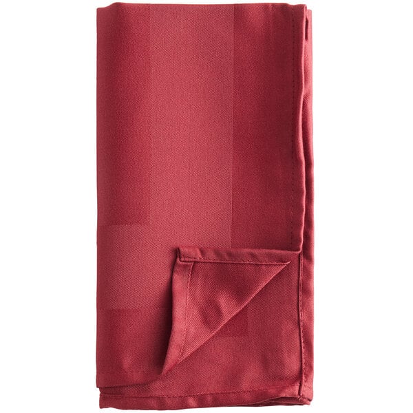 A folded red Oxford cloth napkin on a white background.