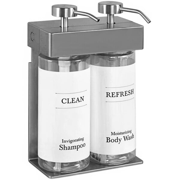 A white wall-mounted Dispenser Amenities shower dispenser with two oval bottles.
