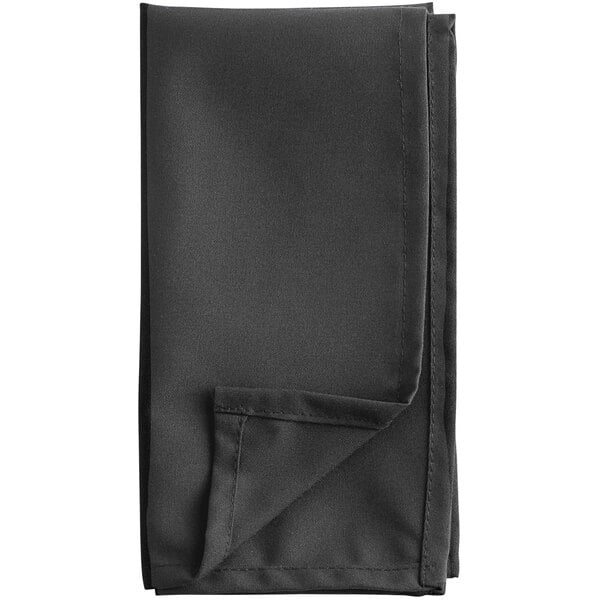 A folded black cloth napkin on a white background.