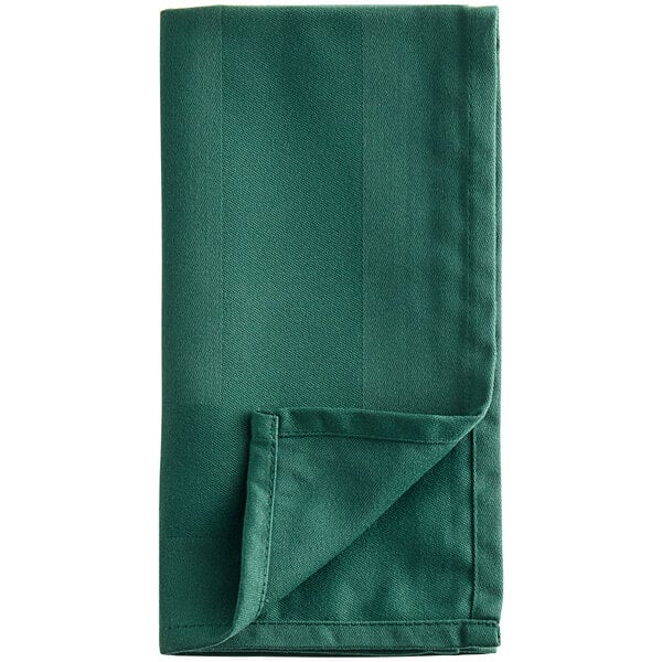 A folded Oxford Forest Green cloth napkin.