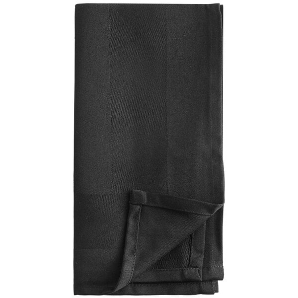 A folded black cloth napkin on a white background.