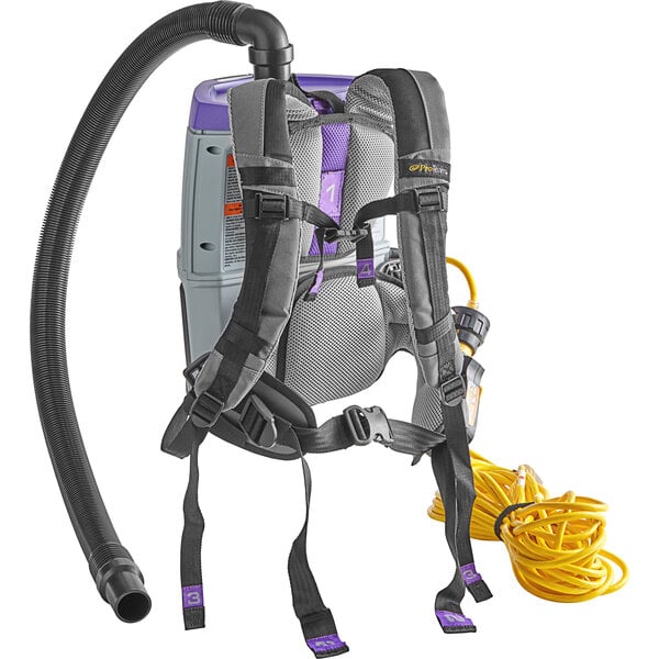 A ProTeam backpack vacuum with a hose attached.