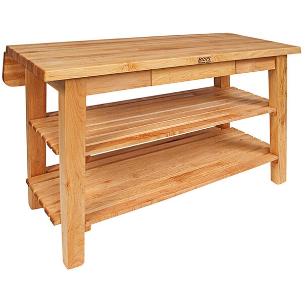 A John Boos maple kitchen island with shelves underneath.