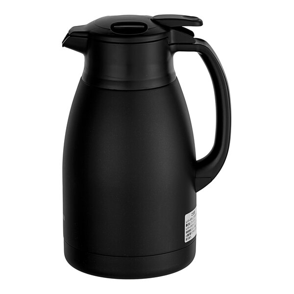 A Zojirushi matte black stainless steel coffee carafe with a handle.