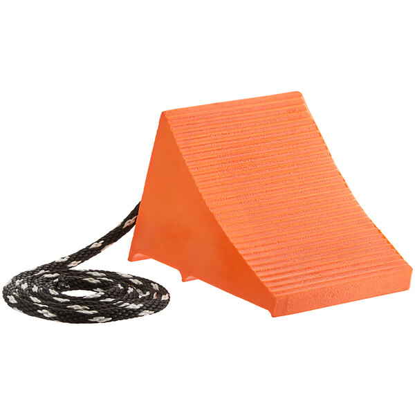 An orange block with a black rope attached to it.