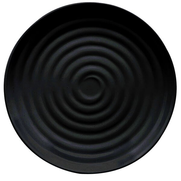 A black melamine plate with a spiral pattern on it.