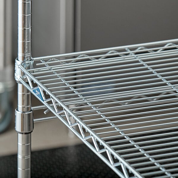 A close up of a Metro Super Erecta Brite metal wire shelf.