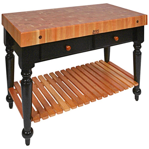 A John Boos wooden kitchen island with two drawers.