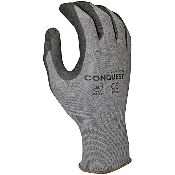 A close-up of a Cordova Conquest gray nylon glove with black micro-foam nitrile palm coating.