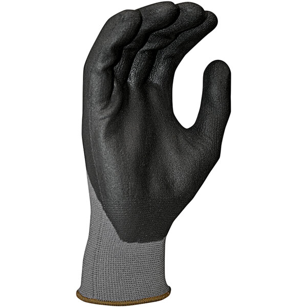 A close-up of a hand wearing a black and gray Cordova Conquest glove.