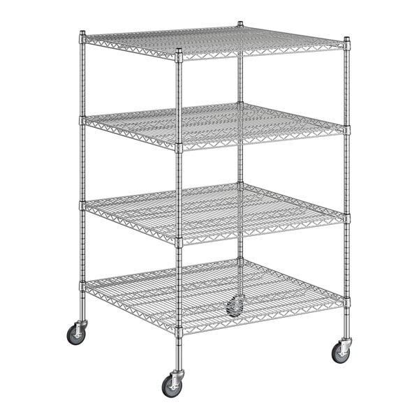 A Regency chrome wire shelving unit with wheels and four shelves.