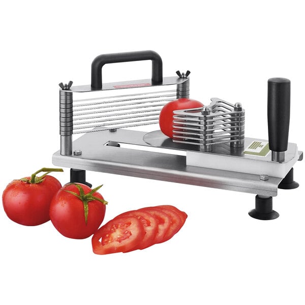 A Tellier 1/4" Mini Tomato Slicer slicing tomatoes.