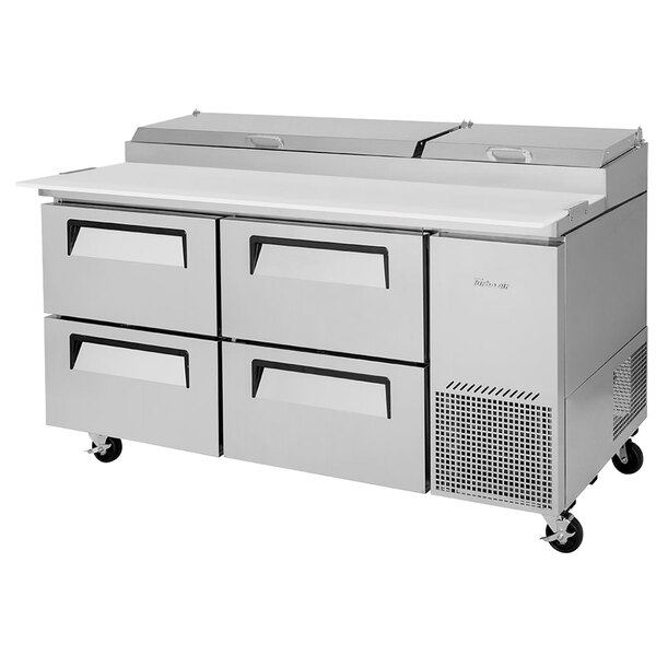 A white Turbo Air pizza prep table with four drawers.