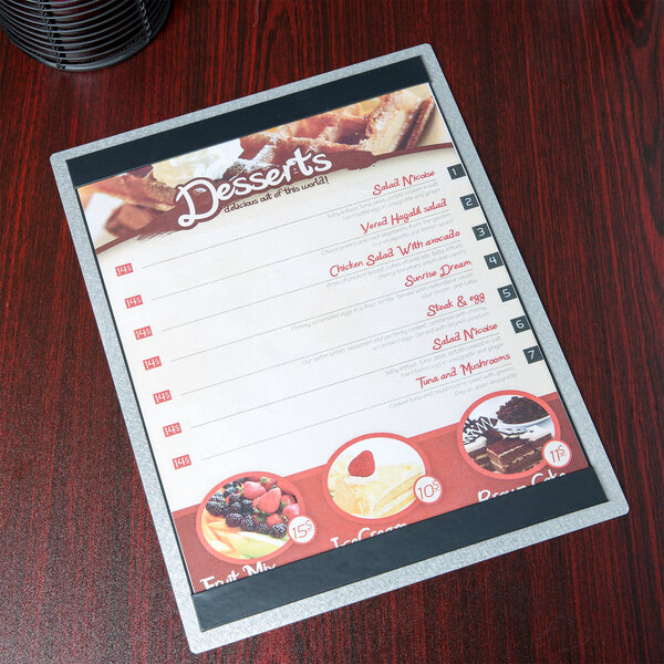 A Menu Solutions Alumitique aluminum menu board on a table.