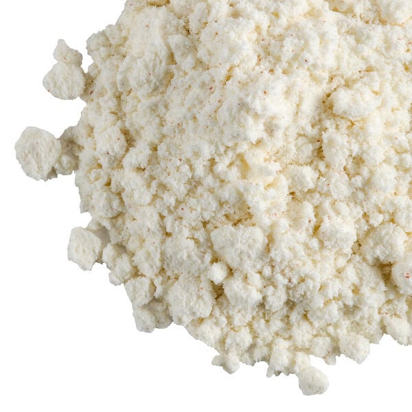 A pile of Chef's Companion powdered cream soup base on a white background.