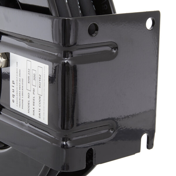 A black Equip by T&amp;S hose reel with a white label on it.