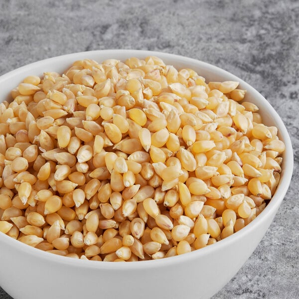 A bowl of Amish Country white baby butterfly popcorn kernels.
