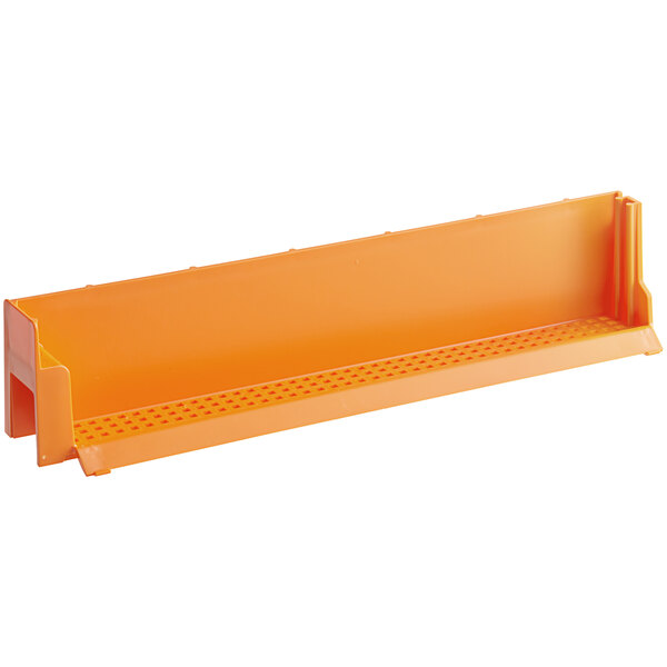 An orange plastic mini dirt container with holes.