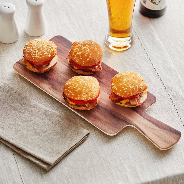 An Acopa faux wood melamine serving board with burgers on it.