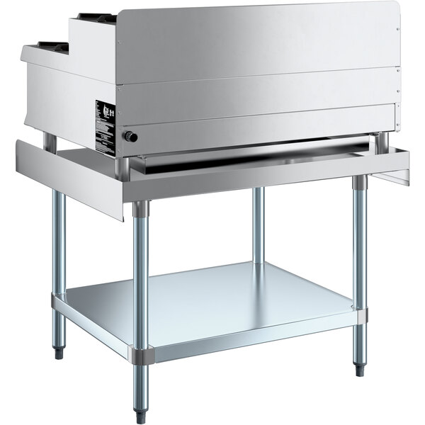 A stainless steel Cooking Performance Group countertop range on a stainless steel stand.