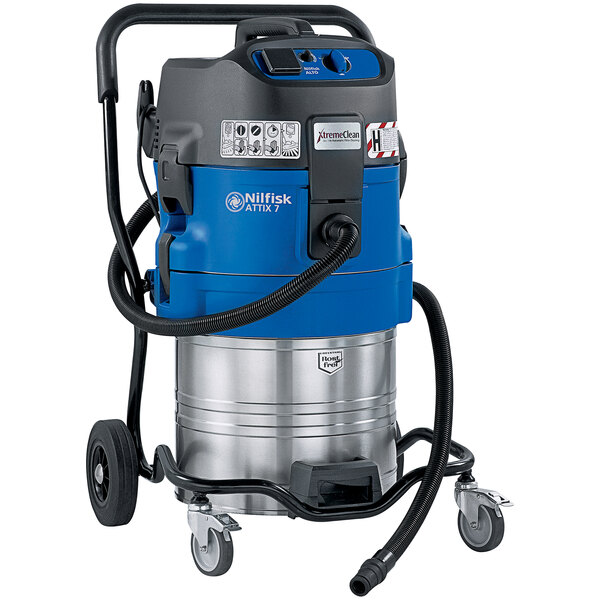 A blue and silver Nilfisk wet/dry vacuum cleaner on wheels.