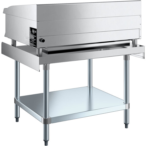 A Cooking Performance Group stainless steel thermostatic griddle on a Regency Equipment stand.