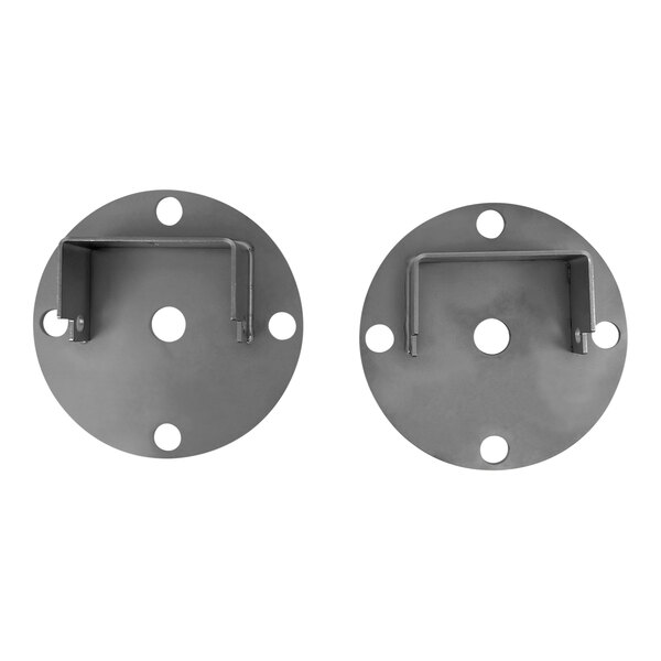 A pair of Eloma metal plates with holes.