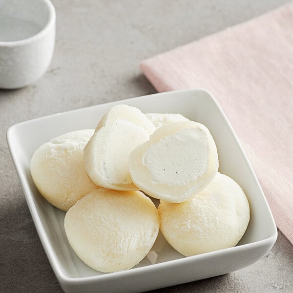 My/Mochi Vanilla Bean Mochi Ice Cream on a white plate.