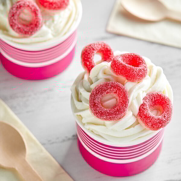 A close up of a red and white Kervan Gummy Cherry Ring.
