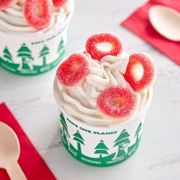 A cup of ice cream with Kervan Gummy Strawberry Rings on top.