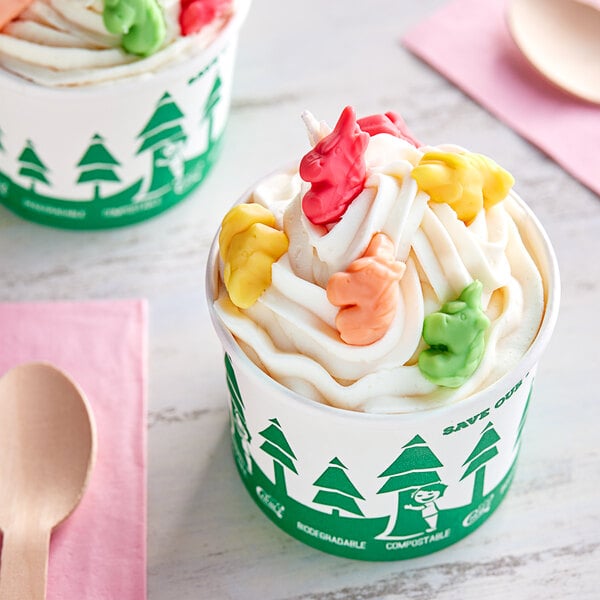 A cup of ice cream with Kervan Gummy Unicorns on top.