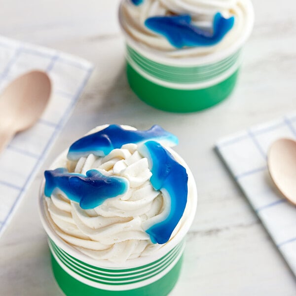 Kervan Gummy Sharks in a white container on a blue and white plate.