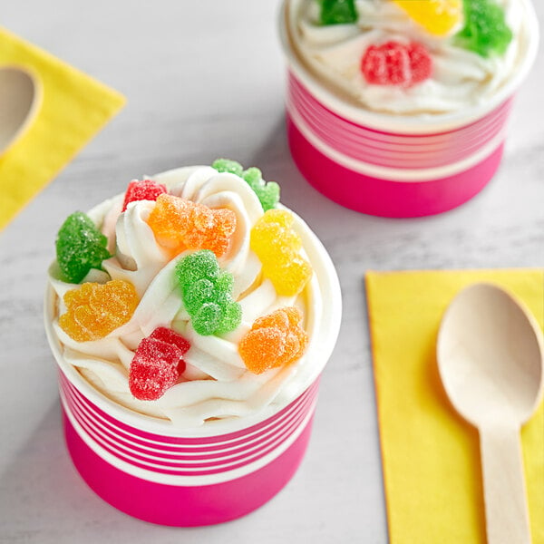 A cup of ice cream with Kervan sour gummy bears on top.