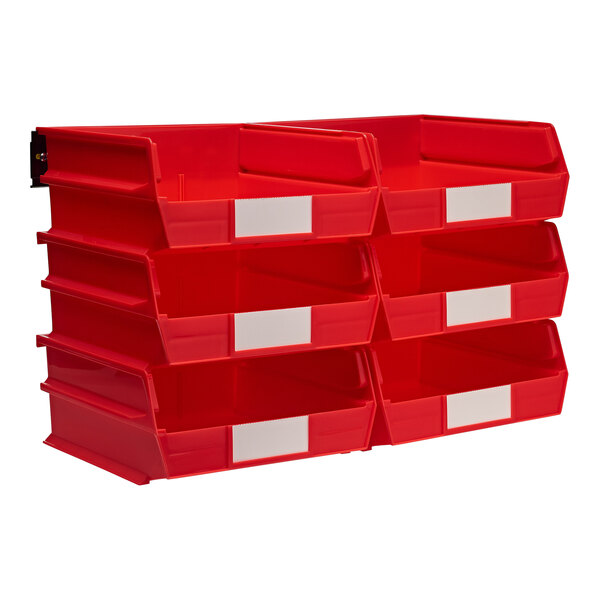 A red plastic wall storage system with white labels holding Triton Products red bins.
