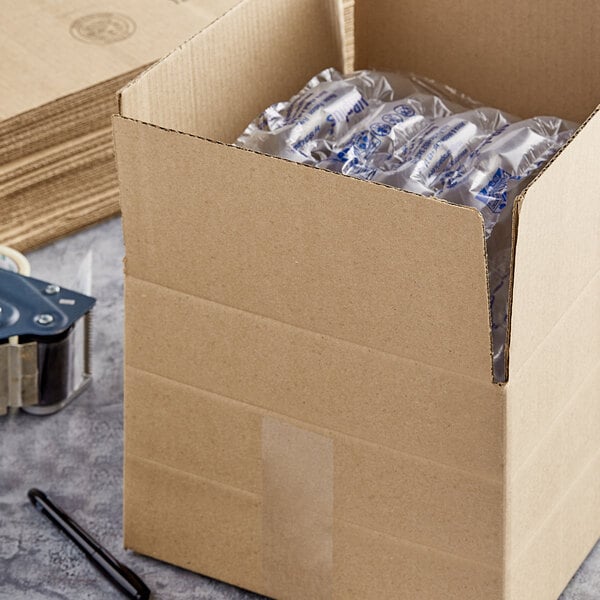 A Lavex Kraft cardboard shipping box with a clear plastic package inside.