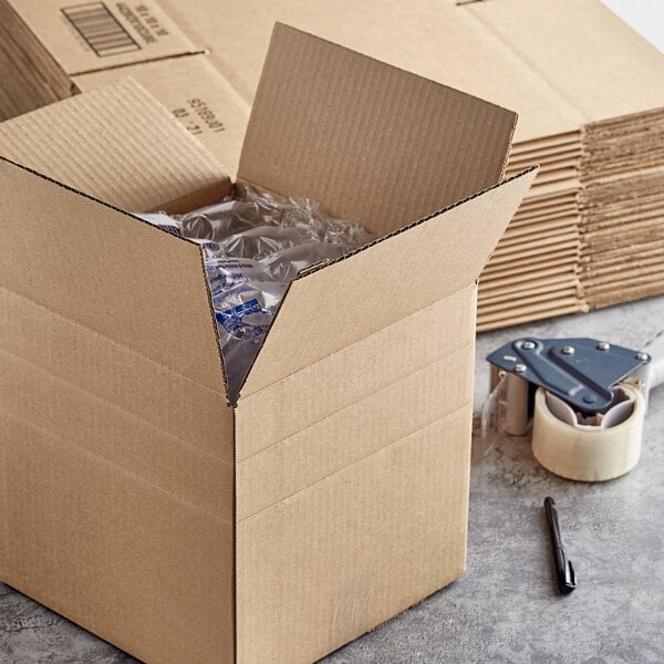 A Kraft corrugated shipping box with multiple boxes inside.