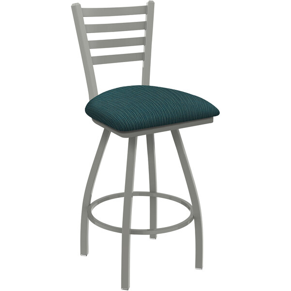 A Holland Bar Stool ladderback swivel counter stool with a blue and gray padded seat.