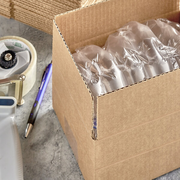 A Lavex Kraft cardboard shipping box with plastic bottles inside.