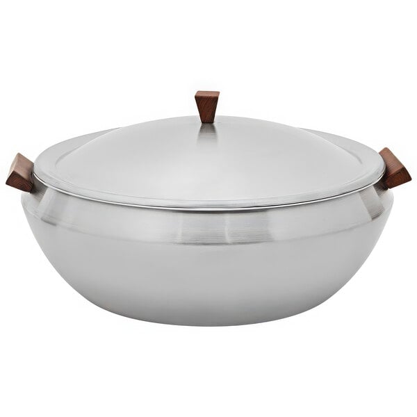 A Spring USA stainless steel induction serving dish with faux wood accents.