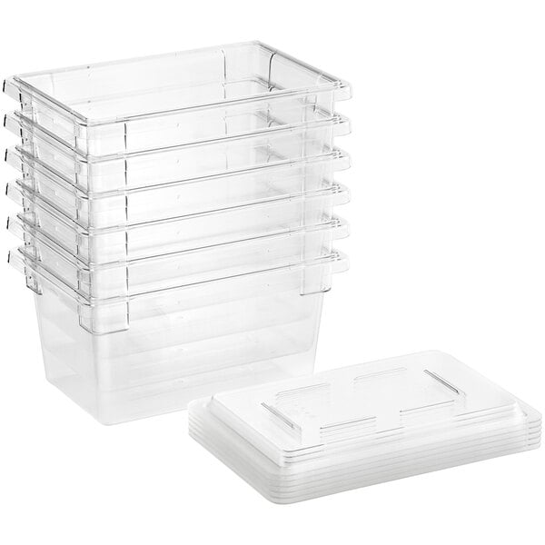 A stack of Cambro clear plastic food storage containers with lids.
